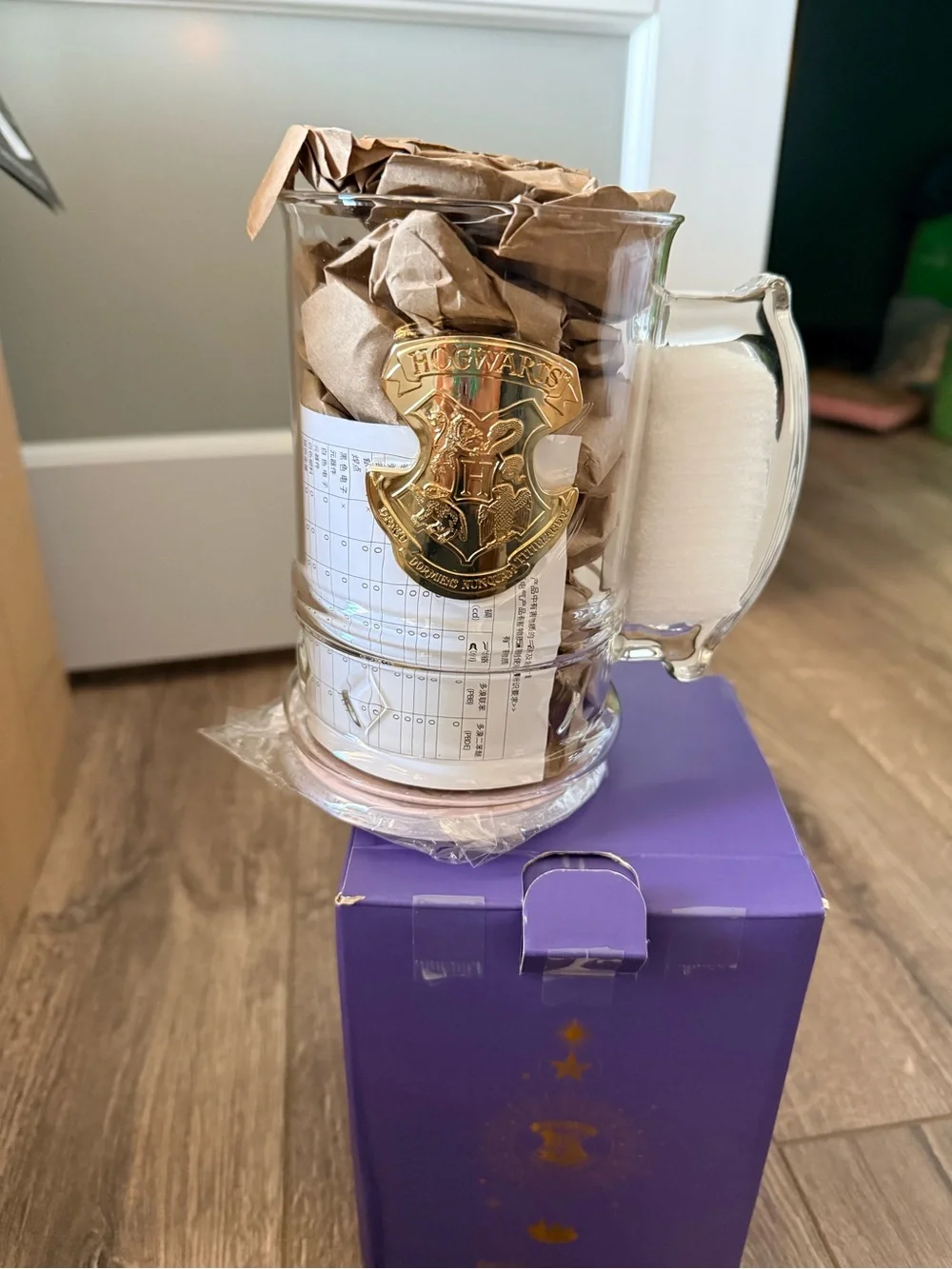 Starbucks Hogwarts Mug with Gold Accents and light on bottom